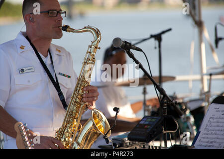 WASHINGTON, D.C. (May 11, 2012) The Navy Band Cruisers performed an evening concert at The Yards Park along the Anacostia River waterfront in Washington, DC. The Cruisers are the Navy's premier contemporary music ensemble. Stock Photo