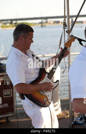 WASHINGTON, D.C. (May 11, 2012) The Navy Band Cruisers performed an evening concert at The Yards Park along the Anacostia River waterfront in Washington, DC. The Cruisers are the Navy's premier contemporary music ensemble. Stock Photo