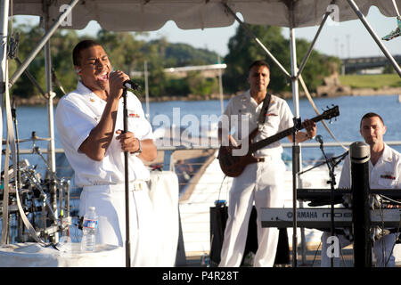 WASHINGTON, D.C. (May 11, 2012) The Navy Band Cruisers performed an evening concert at The Yards Park along the Anacostia River waterfront in Washington, DC. The Cruisers are the Navy's premier contemporary music ensemble. Stock Photo