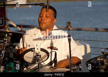 WASHINGTON, D.C. (May 11, 2012) The Navy Band Cruisers performed an evening concert at The Yards Park along the Anacostia River waterfront in Washington, DC. The Cruisers are the Navy's premier contemporary music ensemble. Stock Photo