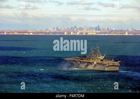 121103-M-LP523-012 NEW YORK (Nov. 3, 2012) The amphibious assault ship USS Wasp (LHD 1) is positioned near New York and New Jersey ready to support disaster relief efforts. The U.S. Navy has positioned forces in the area to assist U.S. Northern Command (NORTHCOM) in support of FEMA and local civil authorities following the destruction caused by Hurricane Sandy. Stock Photo