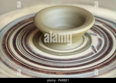 Clay on pottery wheel,  artisan crafts, cheramic art, clay pot, patella Stock Photo