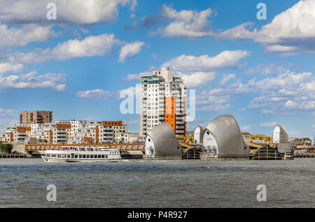 View of the Thames Barrier on a cloudy day under blue sky in London. The Thames Barrier is one of the largest movable flood barriers in the world. Stock Photo
