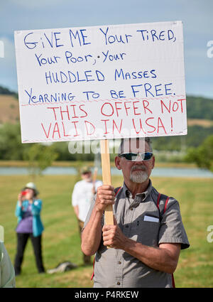 A man holds a sign during a rally outside a federal detention center in Sheridan, Oregon, protesting US government immigration policy. Stock Photo