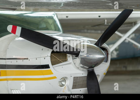 Small Sport Aircraft parked in hangar, close up. detail Stock Photo