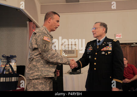 U.S. Army Col. Rothstein and Lt. Col. Alfred Rascon, shake hands  during the Resiliency conference, on Fort Meade, Md., Sept. 20, 2011. Col. Edward Rothstien thanked Rascon for speaking at the conference. Stock Photo