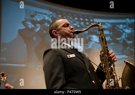 WASHINGTON, D.C. (February 27, 2012) Chief Musician Luis Hernandez plays saxophone with the Navy Band Commodores jazz ensemble during a noontime concert in the Arleigh Burke Theater at the U.S. Navy Memorial in Washington, D.C. The performance was part of the Navy Band's 'Pioneers of Navy Music: A History of African Americans in the Navy Music Program.' The Navy Band is in the process of celebrating Black History Month by presenting a series of concerts at the U.S. Navy Memorial commemorating the musical and cultural contributions of African-American composers and performers to the U.S. Navy a Stock Photo