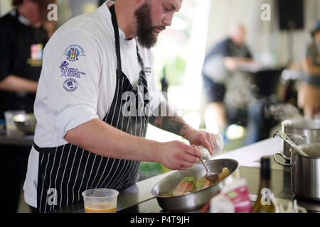 Chef Chris Braun preparing a gourmet competition meal at BC Seafood Festival Chef Challenge 2018 in Comox Valley, British Columbia, Canada Stock Photo