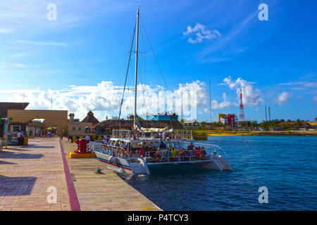Cozumel, Mexico - May 04, 2018: tourists on ferry boat in blue caribbean water at Cozumel, Mexico Stock Photo