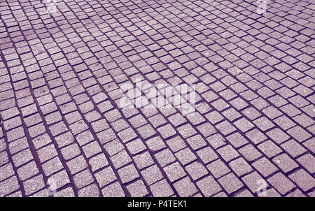 View of an old cobblestone street, color toned urban background. Stock Photo