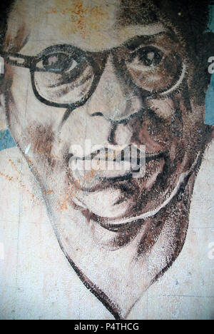 Faces painted on wall of school, Lankathilaka Maha Vidyalaya, Kovilakanda, Sri Lank Stock Photo