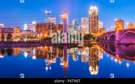 Minneapolis skyline with reflection in river at night. Stock Photo