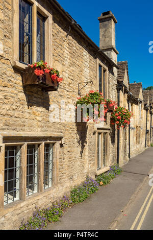 Castle Combe Wiltshire England June 22, 2018 Picturesque village scene of cottages in The Street Stock Photo