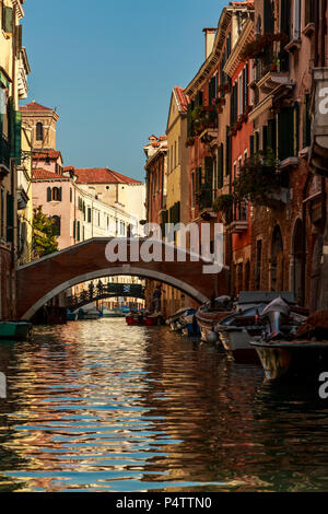 A Venice canal rich with morning sun, shadows, sky and reflections, Venice, Italy. Stock Photo