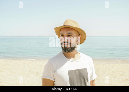 Portrait of a man wearing hat at the beach Stock Photo