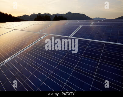Austria, Tyrol, solar plant at evening twilight Stock Photo