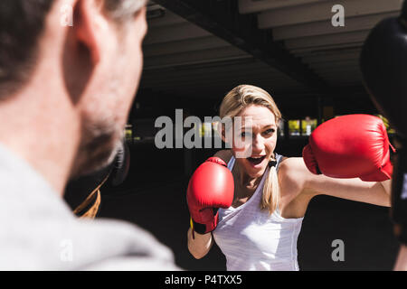 Man and woman in boxing training Stock Photo