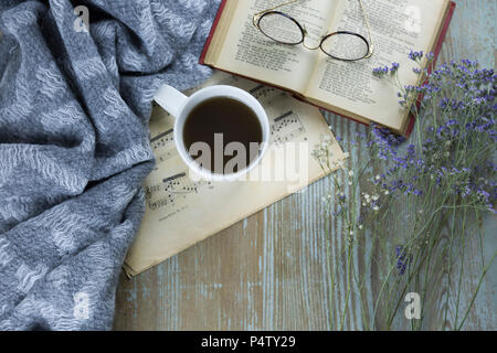 Cup of black coffee, book and spectacles Stock Photo