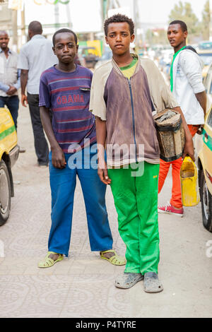 Addis Ababa, Ethiopia, January 27, 2014, Children working as shoe shine boys on the street, looking straight at the camera Stock Photo