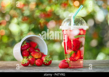 strawberry lemonade in plastic glass Stock Photo