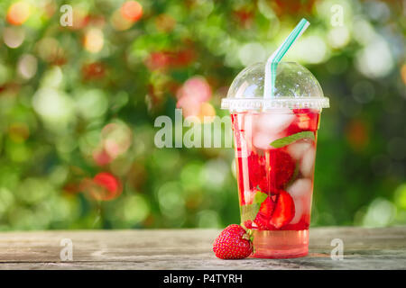 strawberry lemonade in plastic glass Stock Photo