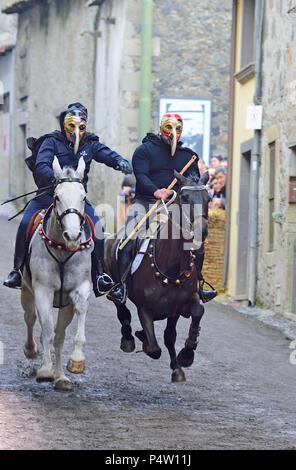 Couple ride reckless horserace 'Sa Carrela e Nanti', during the carnival at Santu Lussurgiu, Oristano, Sardinia, Italy, Europe Stock Photo