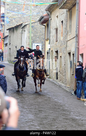 Couple ride reckless horserace 'Sa Carrela e Nanti', during the carnival at Santu Lussurgiu, Oristano, Sardinia, Italy, Europe Stock Photo