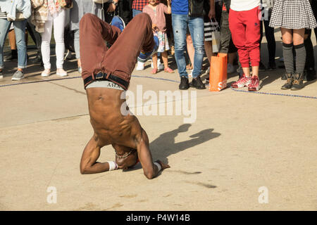 PARIS, FRANCE - 23 JUN 2018: A street dancer doing a dance show in a Paris street Stock Photo