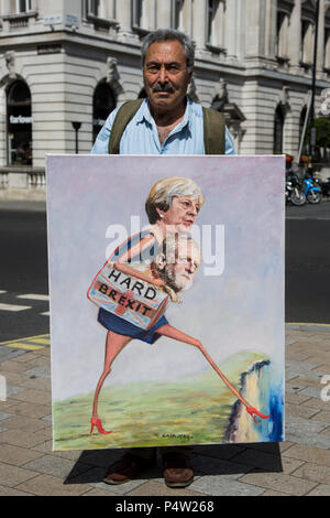 London, UK. 23 June 2018.Anti-Brexit march and rally for a People's Vote in Central London: Political artist Kaya Mar holds his painting 'Hard Brexit' depicting Theresa May and Jeremy Corbyn walking off a cliff edge. Stock Photo
