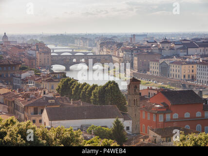 Florence aerial cityscape with waterfront buildings on Arno River, Vasari Corridor, Ponte Vecchio and Uffizi Gallery art museum, Tuscany, Italy Stock Photo