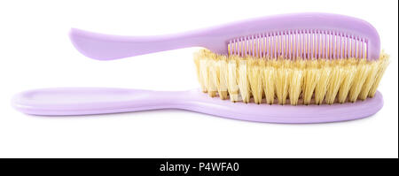 Brush and comb isolated on white background. Kiddie-size hair brushes. Stock Photo