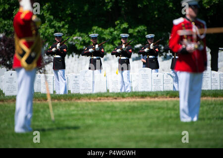 Marines from Marine Barracks Washington perform a three rifle volley during the graveside service for Marine Corps Reserve 1st Lt. William Ryan, in Arlington National Cemetery, Arlington, Va, May 10, 2017.  Declared deceased as of May 11, 1969, Ryan’s remains from the Vietnam War were missing until identified by Defense POW/MIA Accounting Agency (DPAA) in 2016 from an excavated crash site near Ban Alang Noi, Laos. Ryan’s remains were repatriated in Section 60. Stock Photo