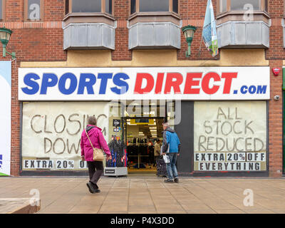 23 May 2018 - Closing Down signs in the windows of the Sports Direct shop in the Old Fishmarket area of Warrington Town Centre, next to The Golden Squ Stock Photo
