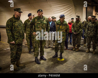 U.S. Marine Corps Lt. Gen. John Wissler, left, commander of U.S. Marine Corps Forces Command, speaks with Capt. Ola Gilberg, Frigaard Cave Manager, during a cave site tour along with other Marines and Norwegian leaders in Norway, May 9, 2017. The tour was included as a part of the commander’s conference hosted by Marine Forces Europe and Africa. Marine Corps Prepositioning Program in Norway enhances strategic options to defend our NATO partners and U.S. interests abroad. Stock Photo