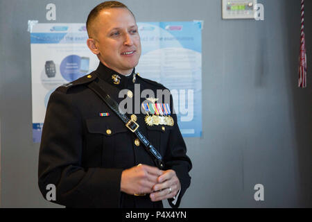 Captain Seth Dellinger, an officer selection officer for Recruiting Station Orlando, speaks during 2nd Lt. Mitchell Harrisons’ Commissioning Ceremony at Embry-Riddle Aeronautical University’s College of Business in Daytona Beach, Florida, May 10, 2017. The ceremony commemorated Harrisons’ commission as a second lieutenant in the Marine Corps. Harrison completed the 10-week long Officer Candidates School and is preparing to leave for The Basic School in July 2017. Stock Photo