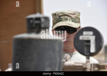 Staff Sgt. Kevin Gordon, 407th Expeditionary Logistic Readiness Squadron petroleum, oil and lubricants flight fuels facilities manager, starts a fuel pump when receiving a shipment May 10, 2017, in Southwest Asia. Fuel technicians maintain all POL substances, from diesel and gasoline to jet fuel and liquid oxygen. These materials play a vital role in delivering airpower to the fight against ISIS as part of Operation Inherent Resolve. The team here at the 407th Air Expeditionary Group supplies U.S. Marine Corps, Italian Air Force and Polish Air Force. Stock Photo