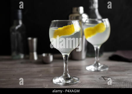 Gin fizz cocktail with lemon, cucumber, rosemary and ice. Gin tonic or gimlet on black background, copy space. Stock Photo