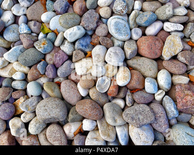 Multicolored round stones or pebbles background Stock Photo
