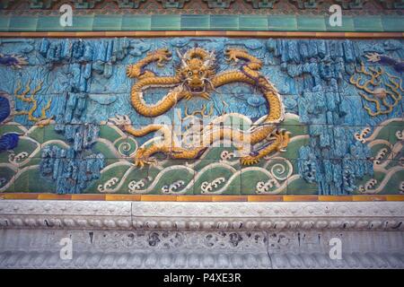 China. Beijing. Nine Dragons Screen (18th century). Detail. Forbidden City. Stock Photo