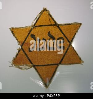 Star worn by Jewish prisoners. Sachsenhausen concentration camp Museum. Oranienburg. Germany. Stock Photo