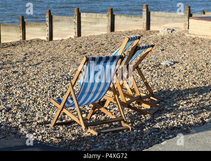 Deck Chairs on Whitstable Beach , Kent Stock Photo