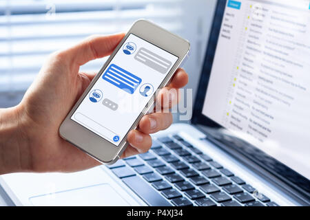 Chatbot conversation on smartphone screen app interface with artificial intelligence technology providing virtual assistant customer support and infor Stock Photo