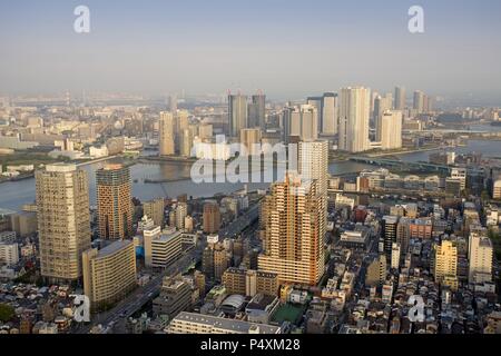 Japan. Tokyo. Overview of the Chuo Ku District with the Sumida River, at sunset. Stock Photo