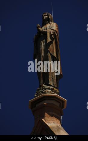 United States. Santa Fe. Loretto Chapel. 19th century. Statue of Virgin Mary at the top. State of New Mexico. Stock Photo