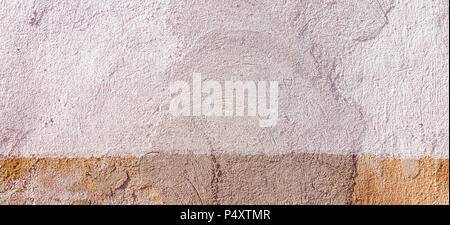 Old renovated plastered painted in two colors wall texture background Stock Photo
