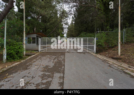 Metal security gate at entrance driveway to Villa Galeb the holiday home of former Yugoslaiva FSR President Josip Broz Tito at Herzeg-Novi, Montenegro Stock Photo