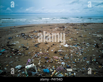Plastic bags, bottles and other trash polluting beach in Sumatra, Indonesia Stock Photo