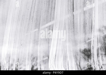 whitewash brushstrokes on glass greenhouse windows surface background Stock Photo