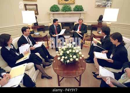 President George W. Bush meets with White House Counsel Alberto Gonzales and staff Feb. 28, 2001 for a judicial selection meeting in the Oval Office. Participants include, from left: Andy Card, Courtney Elwood, Brad Berenson, Brett Kavanaugh, Helgi Walker and Tim Flanigan.  Photo by Eric Draper, Courtesy of the George W. Bush Presidential Library