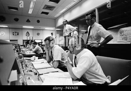 View of activity at the flight director's console in the Mission Operations Control Room in the Mission Control Center, Building 30, on the first day of the Apollo 10 lunar orbit mission Stock Photo